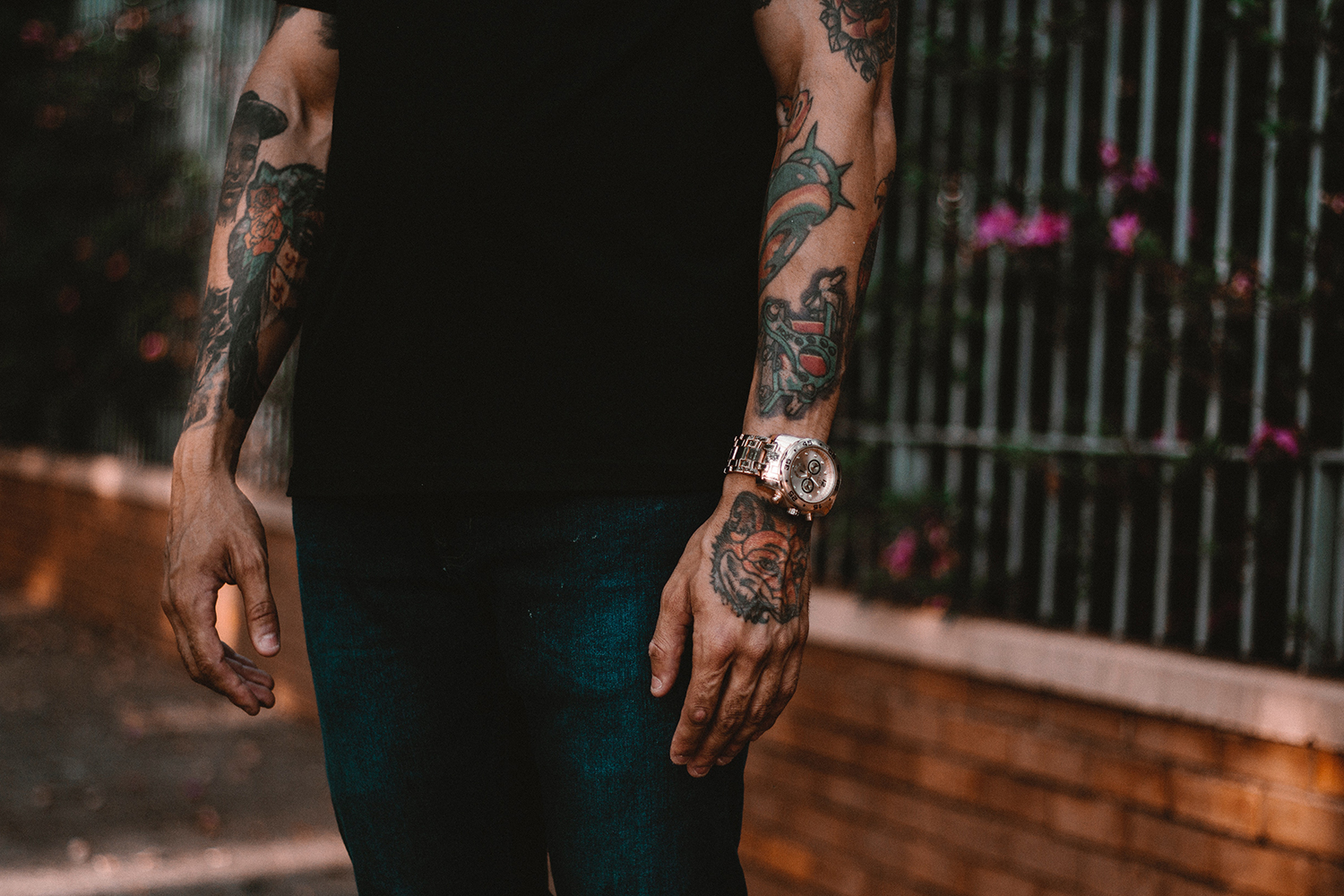 Man with tattooted arms