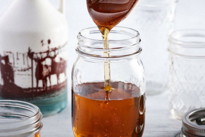 A jar of fresh maple syrup.