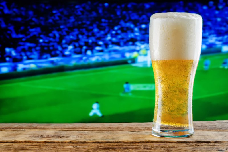 A pint of beer and a soccer match.