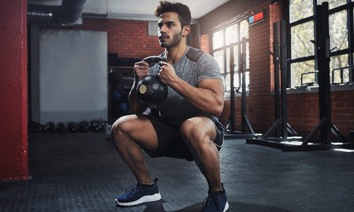 Man doing goblet squats