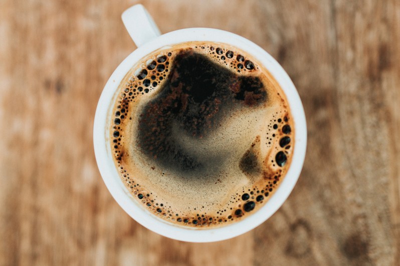 A cup of coffee photographed from above.