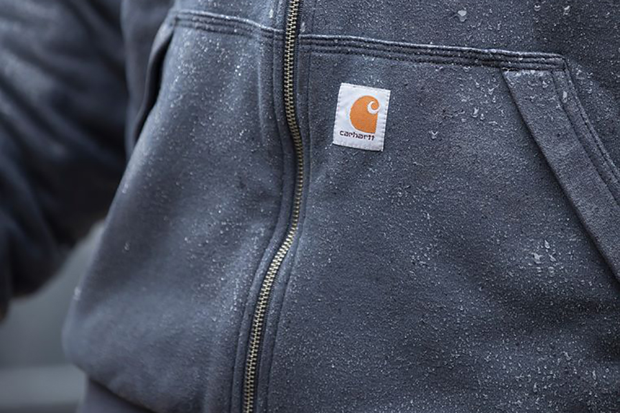 The Carhartt logo on a sweater.