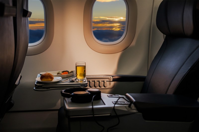A meal with drink on a plane