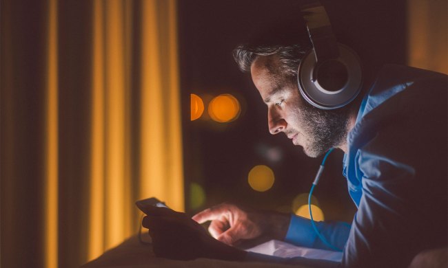 Man listening to a podcast with headphones