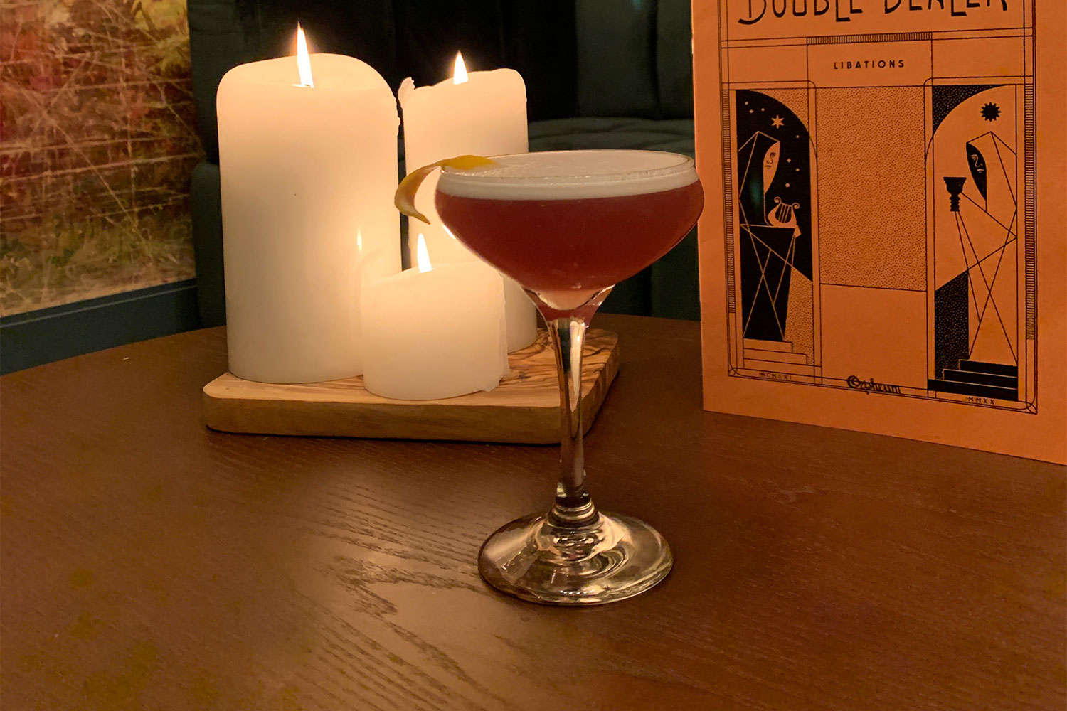 The Mary Pickford with candles and a book on a background