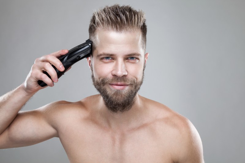 Man cutting own hair