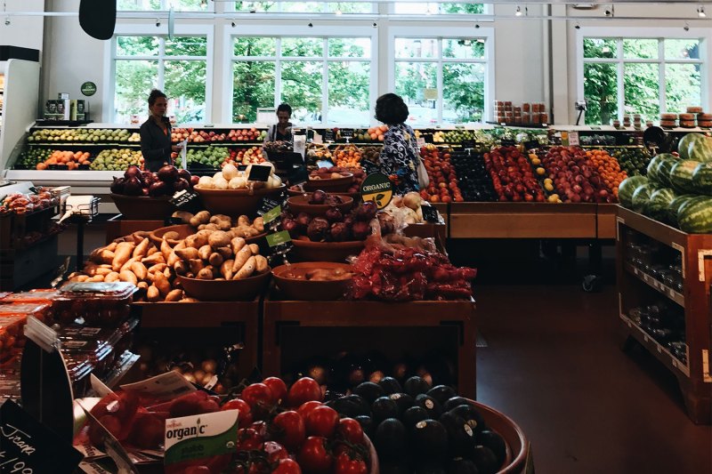 People at a grocery store produce section