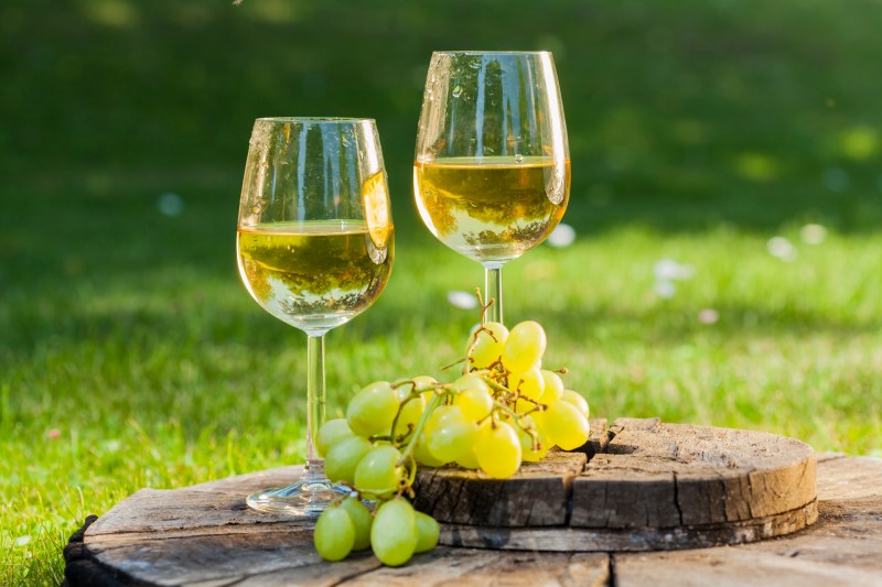 Sauvignon blanc white wine on a table with grapes
