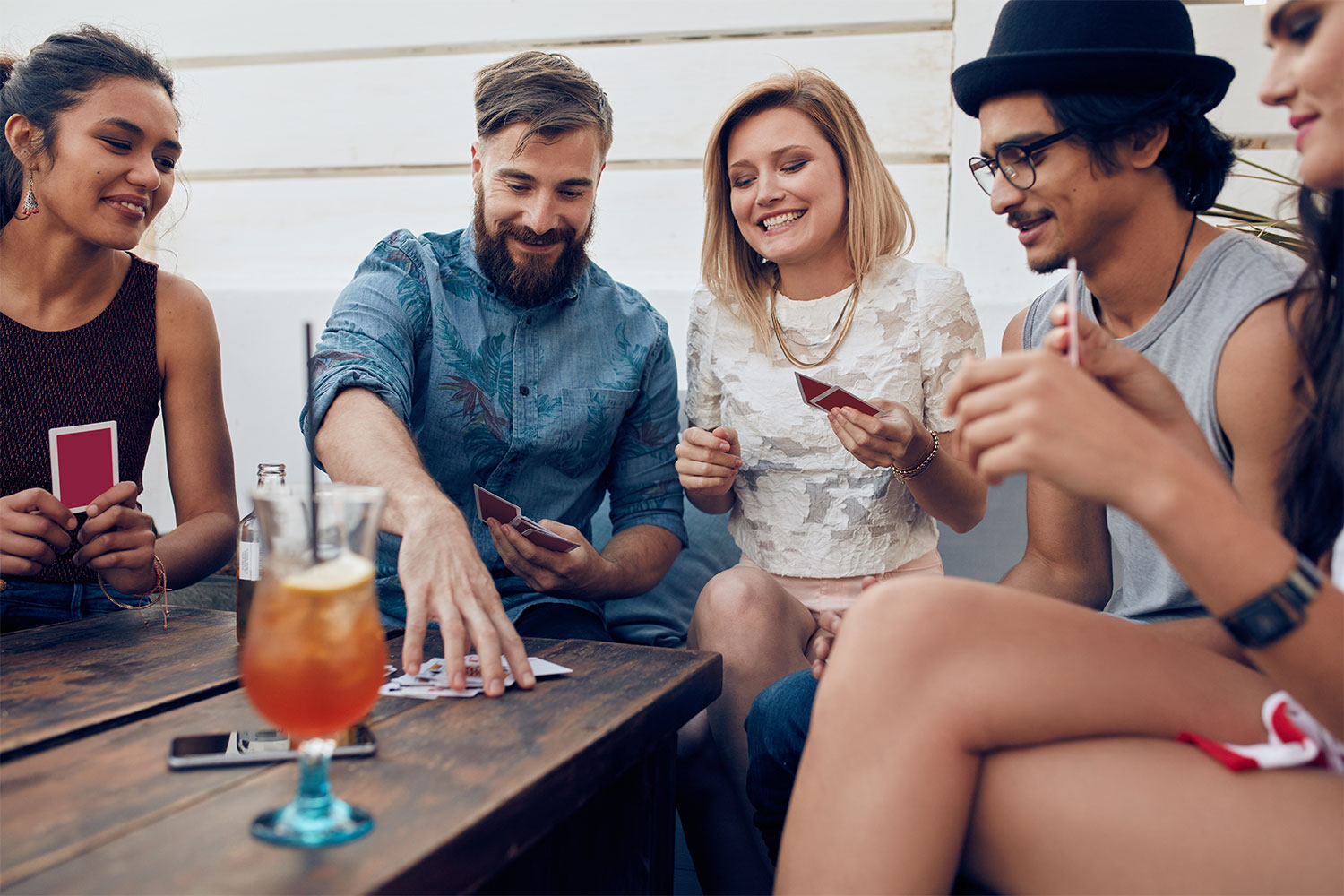 Friends playing drinking card game