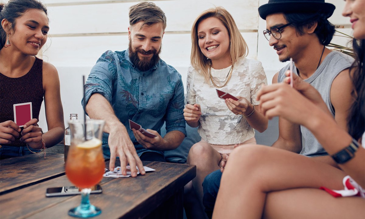 Friends playing drinking card game