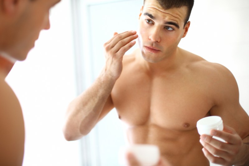 Man applying night cream
