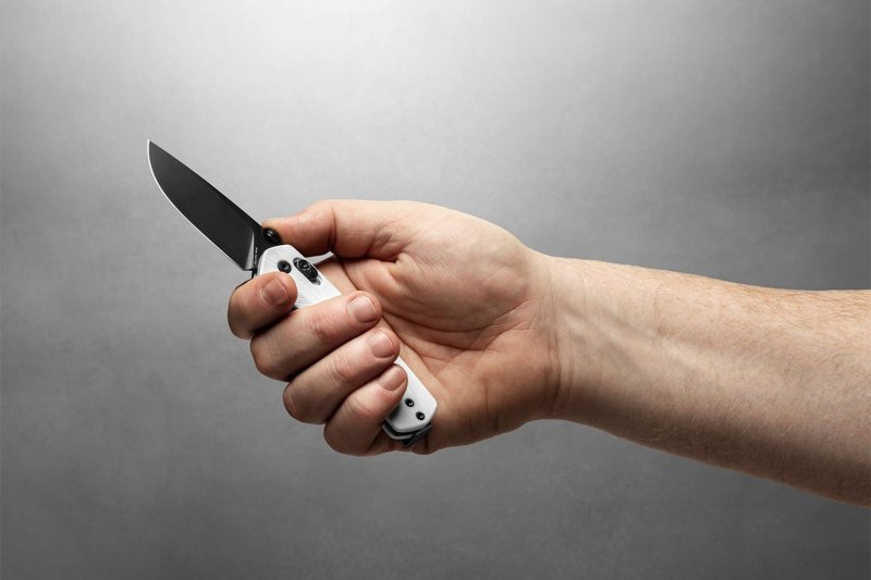 Hand holding a flipper knife