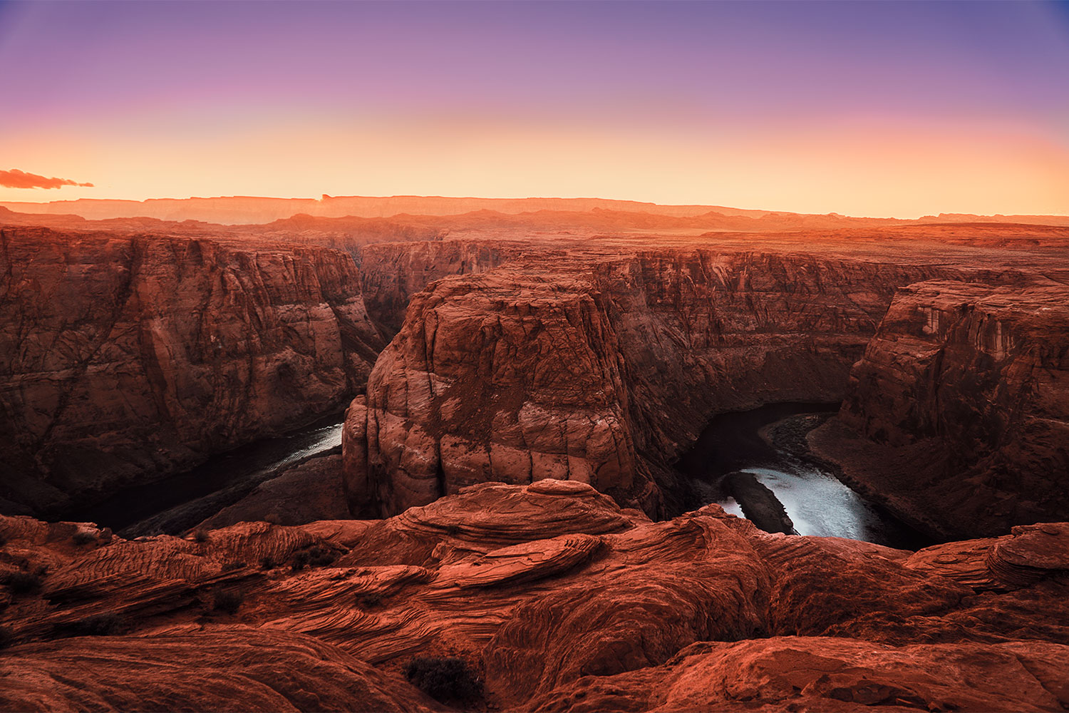 Looking out over the rim of The Grand Canyon at sunset.