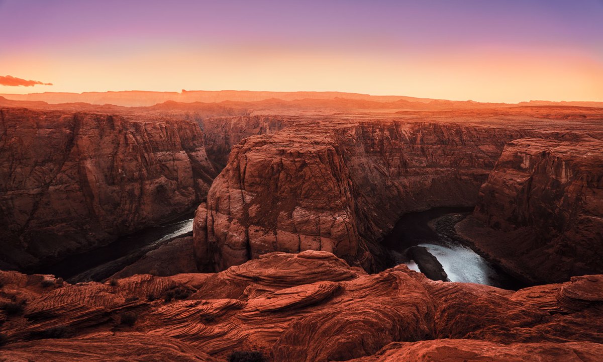Looking out over the rim of The Grand Canyon at sunset.