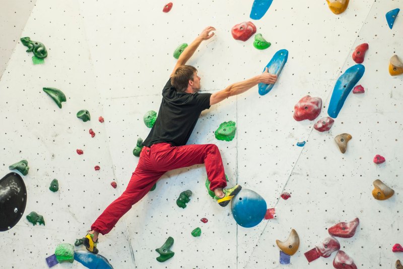 A climber reaching.