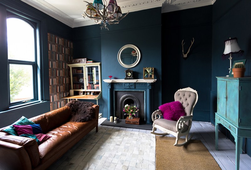 A living room with high ceilings and architectural features.