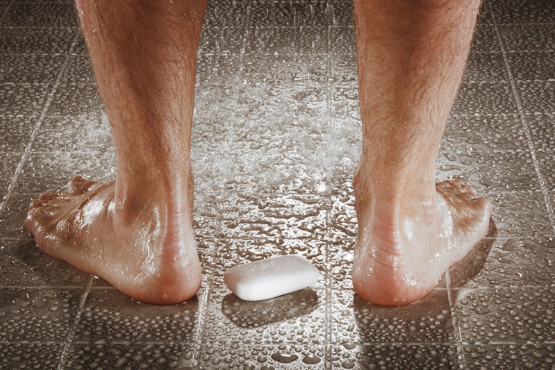 Man washing his feet. 