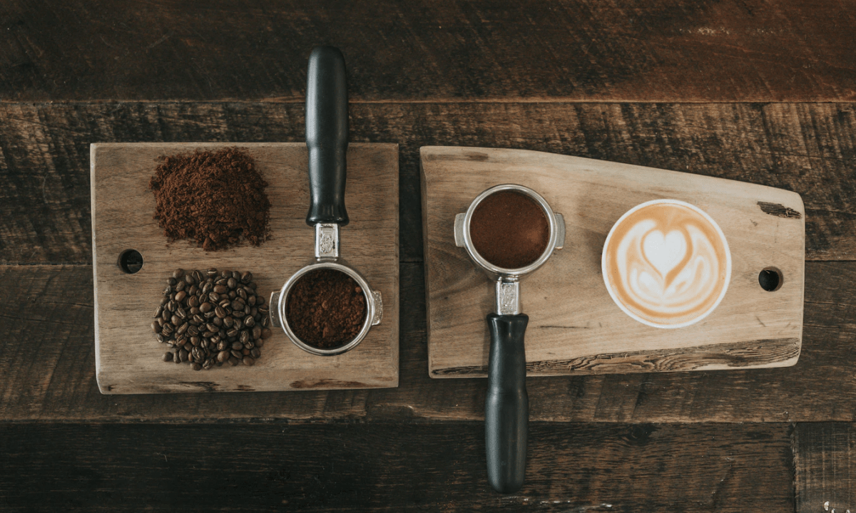 Coffee beans, ground coffee, and a cup of coffee
