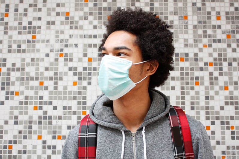 Man wearing pollution mask
