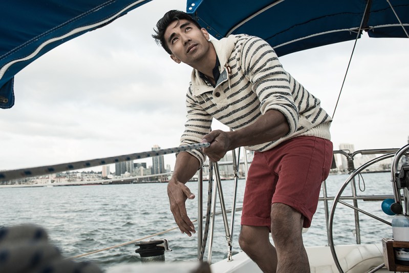 Man wearing sweater and shorts