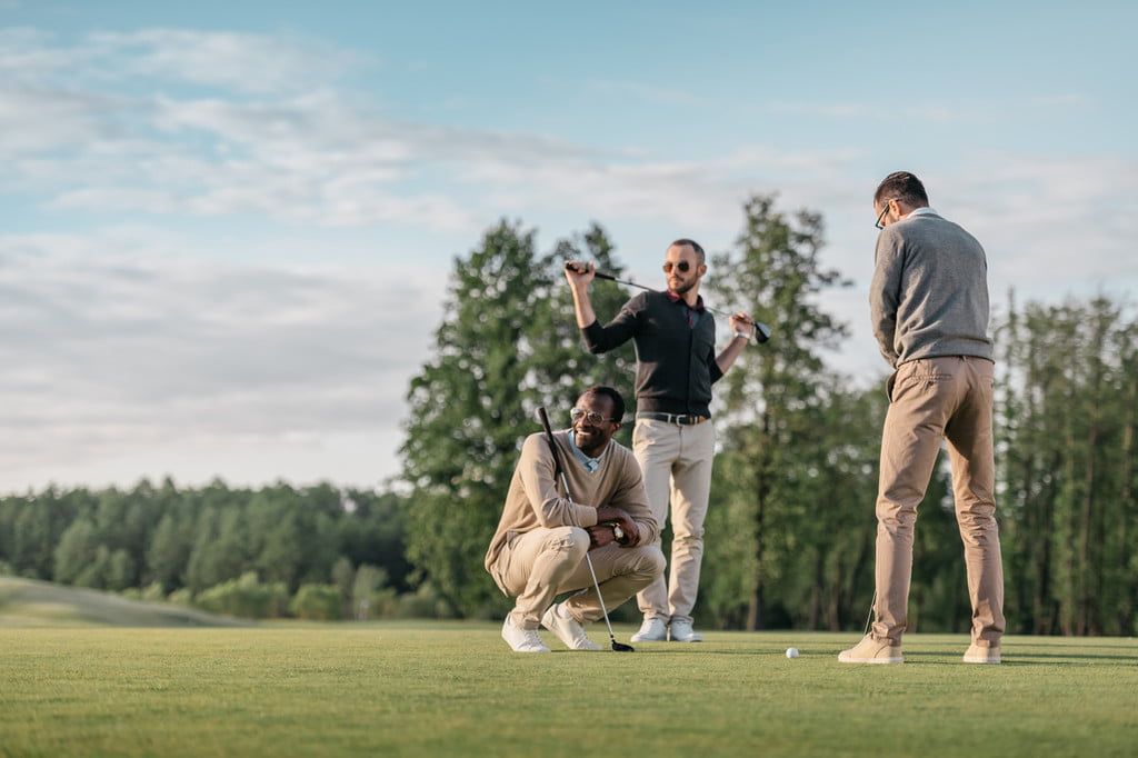 A group of friends playing golf.