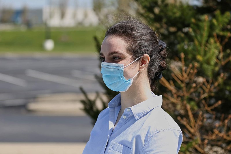 Woman Wearing Disposable Single-Use Blue Face Mask