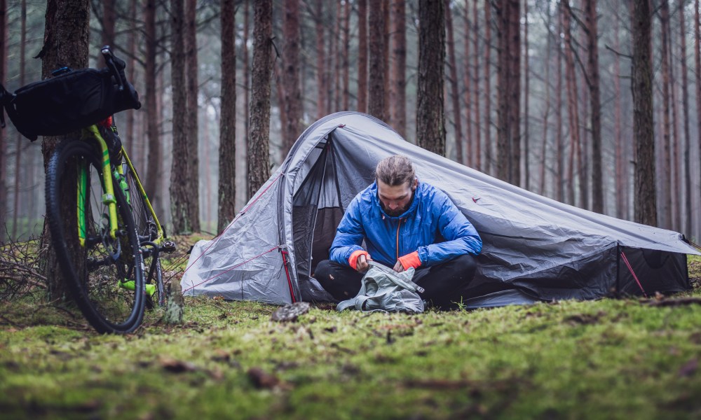Man camping in the fall