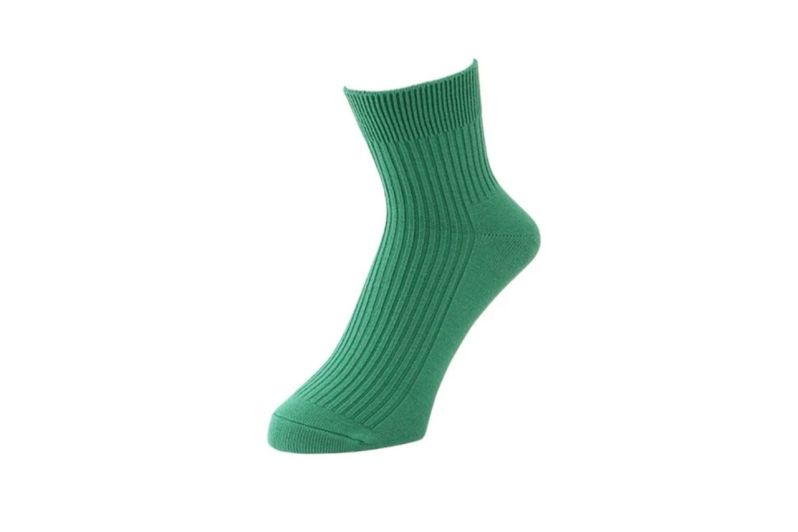 A green Tabio Power Fit Cotton Short Crew Sock.