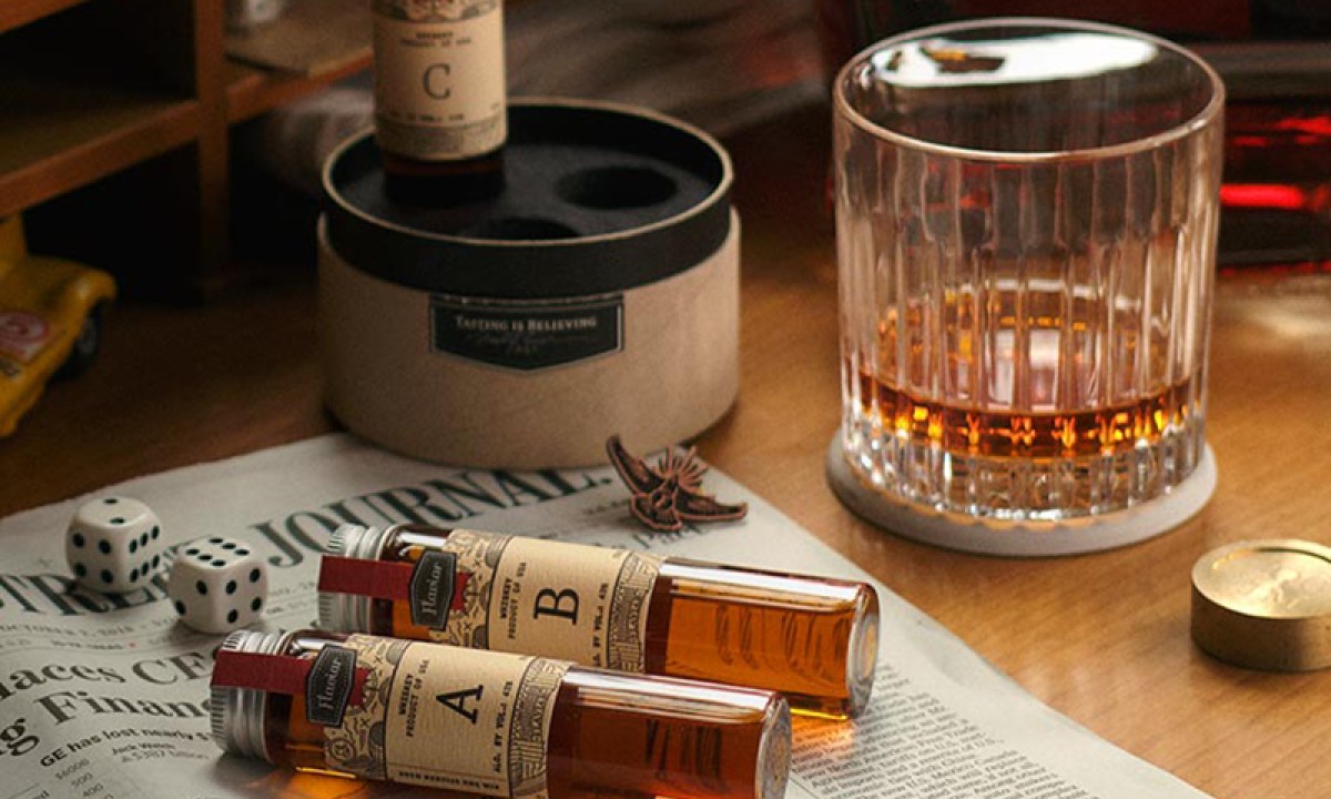 Flaviar subscription with whiskeys on table.