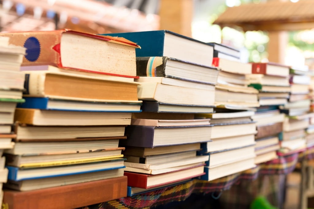 pile of books on a table