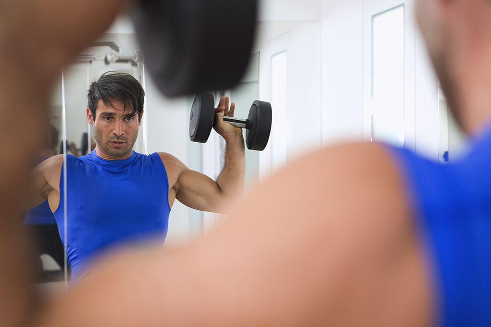 Lifting weights in the mirror.