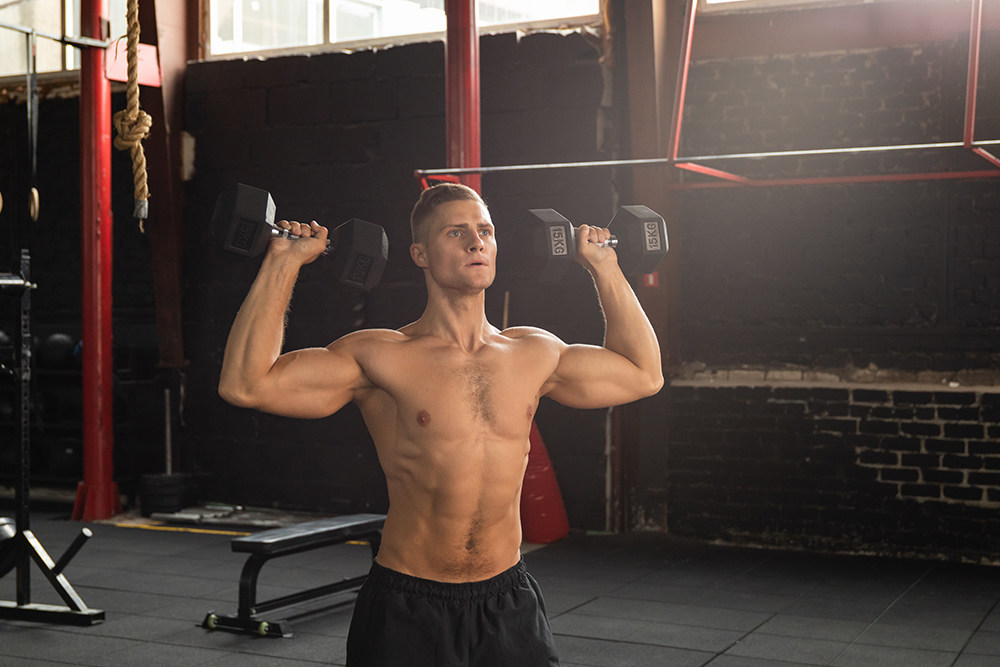 Bodybuilder doing shoulder press