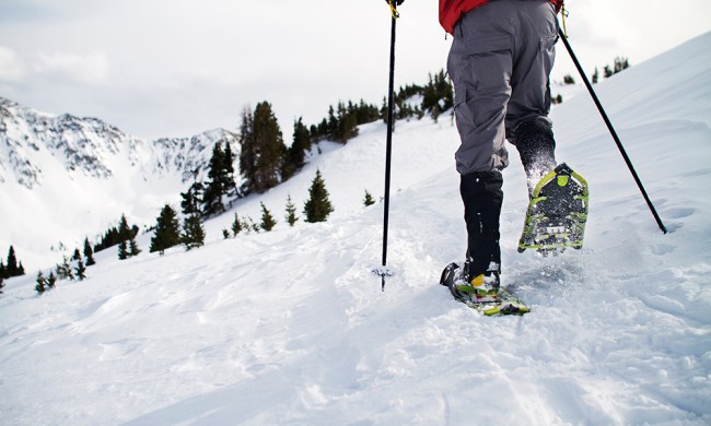 tips for snowshoeing low section of man walking on snow field