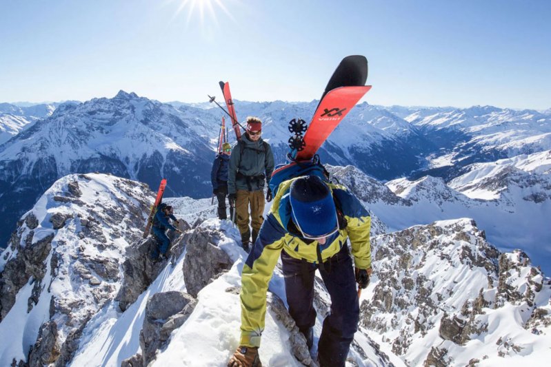 People on a mountain with ski gear