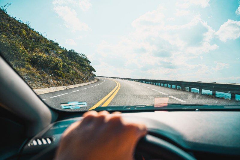 Personal perspective of person driving on mountain road