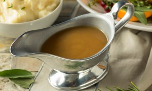 Hot brown organic turkey gravy in a boat