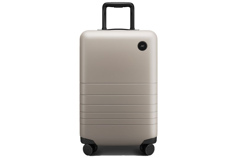 Monos Carry-On Luggage on a white studio background.