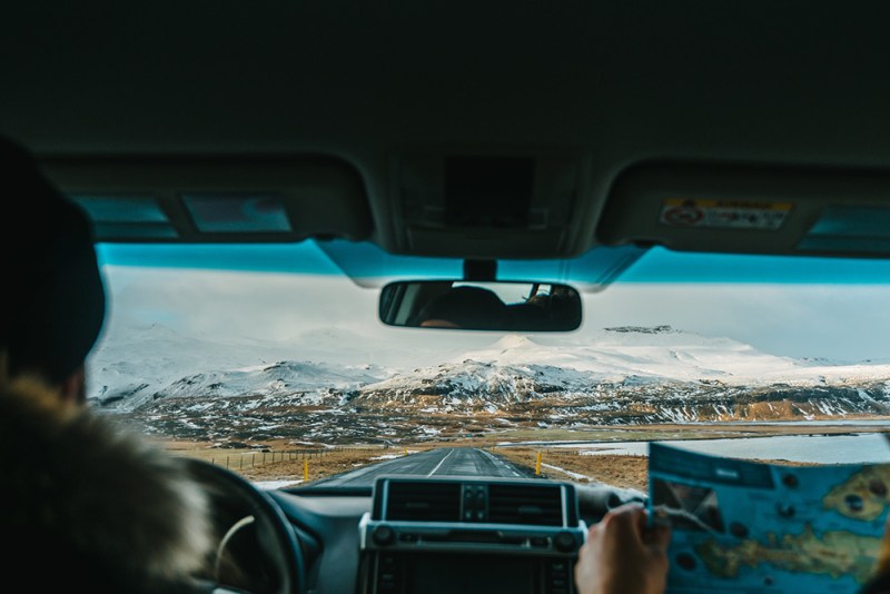 Interior view of man driving car.