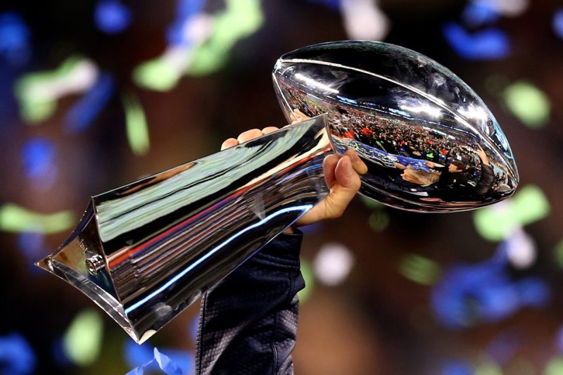 The Super Bowl trophy being held up