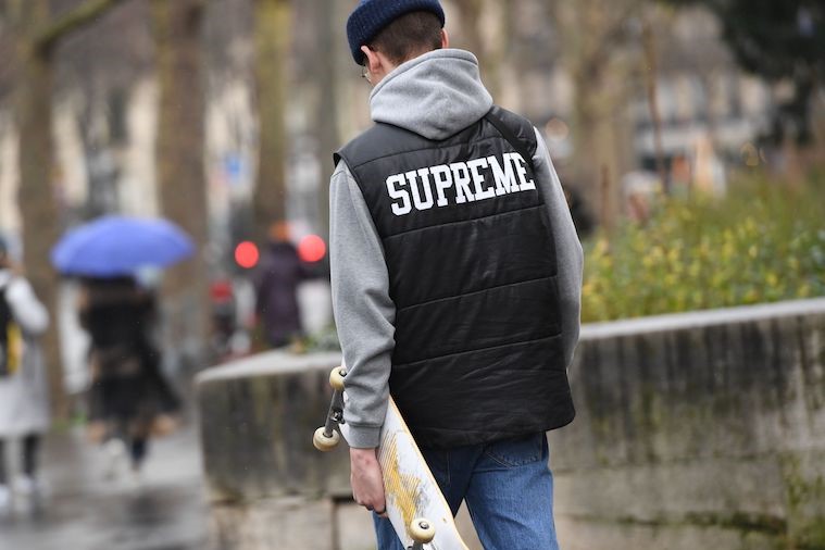Man carrying a skateboard