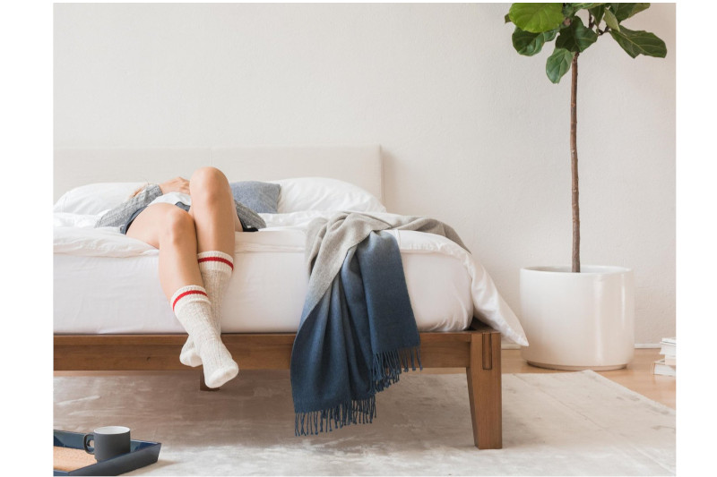 A Thuma bed frame and resting person