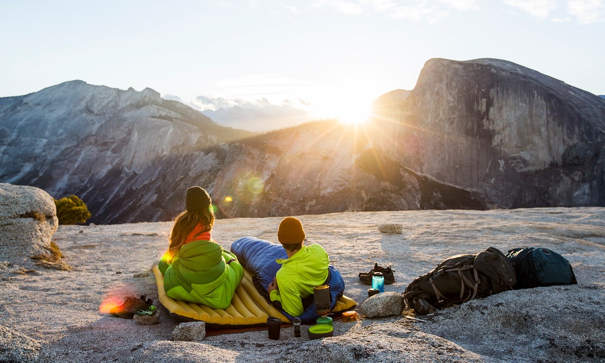 Sitting on an air mattress while camping