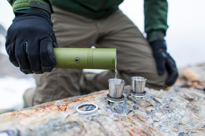 Man pouring liquor from a flask