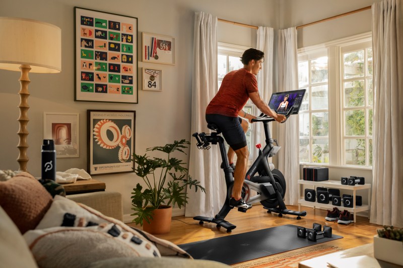 Cyclist on a Peloton in living room.