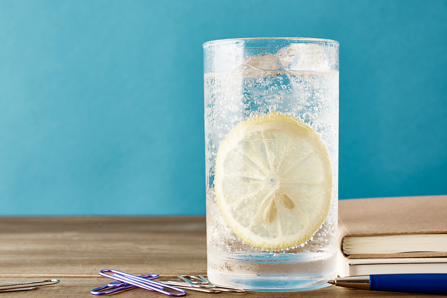 Glass of sparkling water with lemon