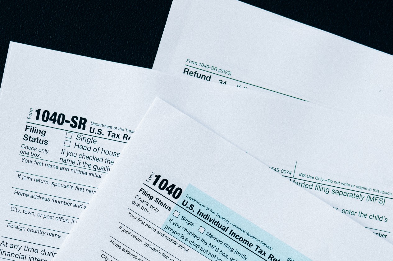 stack of income tax forms on a table