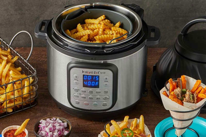 Instant Pot Duo Crisp with prepared foods on counter for snacking!
