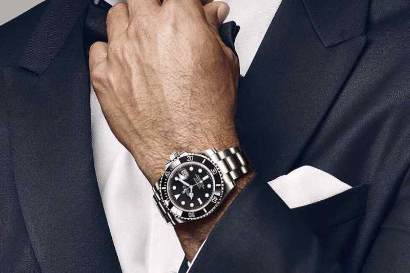 Man wearing a suit and a Rolex