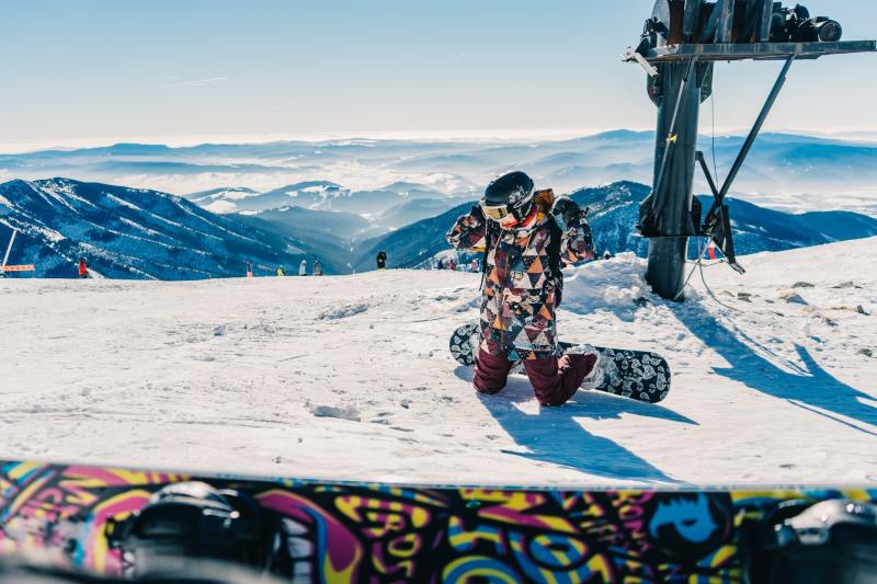 Snowboarder kneeling