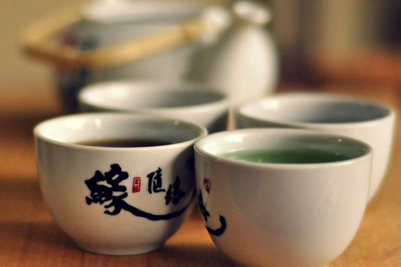 white tea cups served with hot tea.